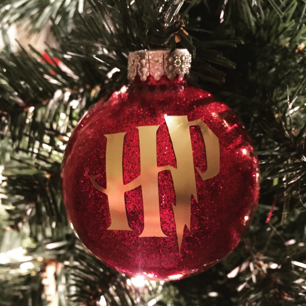 Harry Potter Ornament made with a DIY Glitter ornament and cricut vinyl
